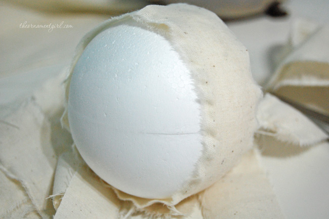 glue strip of fabric around styrofoam ball