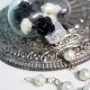 black and white roses in glass ornament