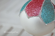 decorate a Christmas ornament with glitter