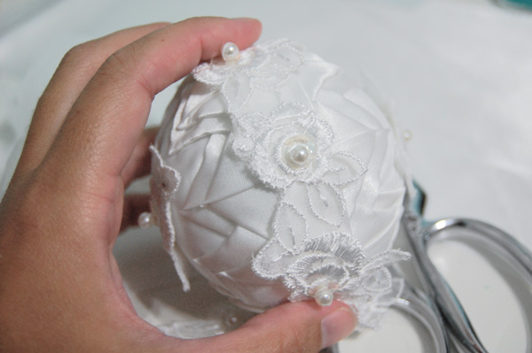 adding applique around handmade wedding ornament