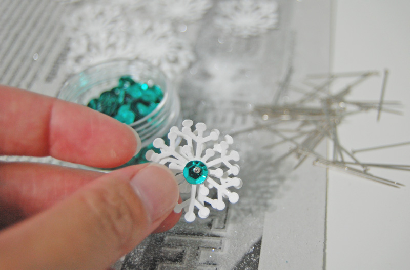 pin sequin to paper snowflake punch