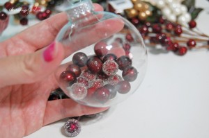 fill glass ornament with holly berries