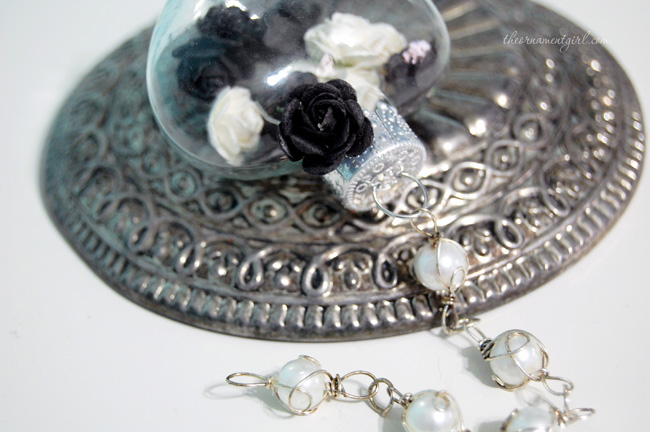 black and white roses in glass ornament