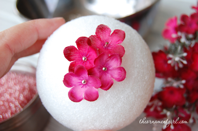 pin flowers onto styrofoam ball
