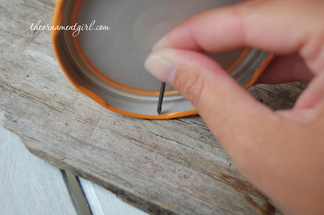 make a hole in the jar lid