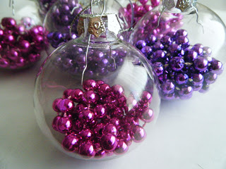 clear glass ornament filled with bead necklaces