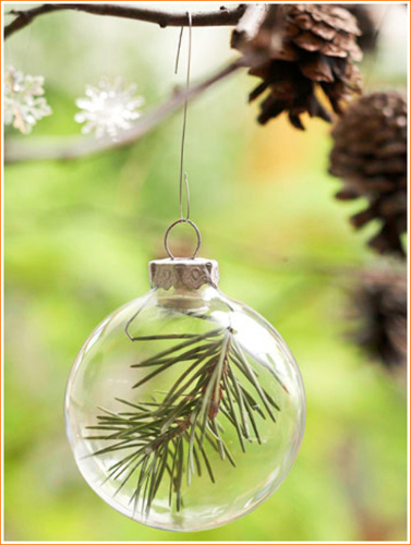 pine needles inside glass ball ornament