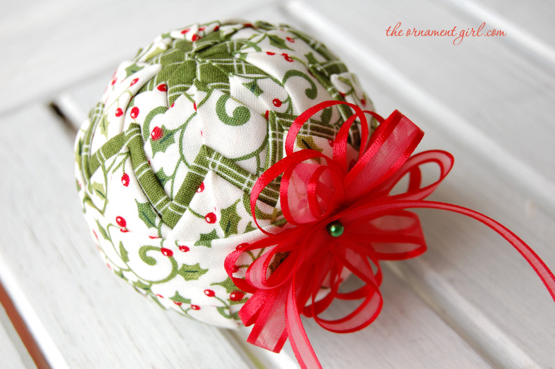 Quilted ornament made with fabric.